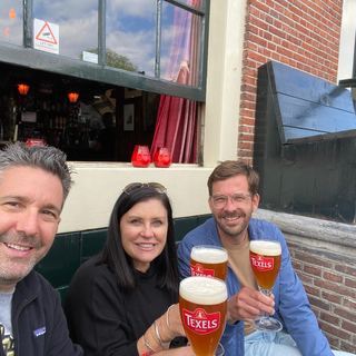 Guests with Dennis on a canal boat in Amsterdam