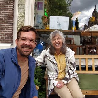 Guests with Dennis on a canal boat in Amsterdam