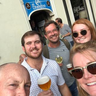 A family with Dennis on a bridge over an Amsterdam canal