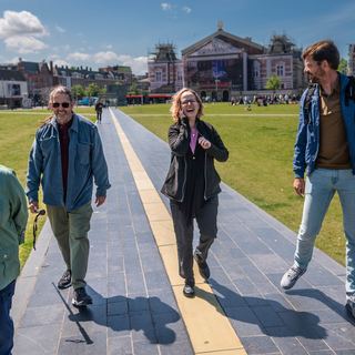 Guests cycling with Dennis through Amsterdam