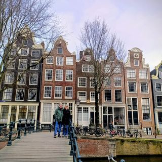 Guests with Dennis by the water in Amsterdam Noord